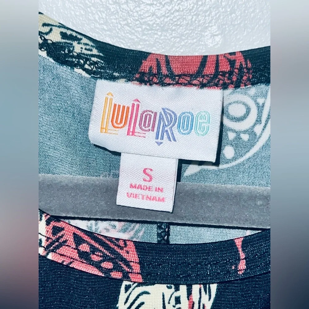 LuLaRoe Carly High Low Dress with Feather Pattern in Black, Coral, and Cream - Picture 2 of 3